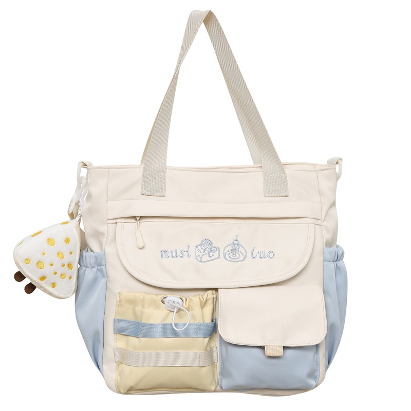 New cute color-blocking large-capacity single-shoulder bag, soft girl hand-held crossbody bag, high appearance level student make-up class bag Item Picture