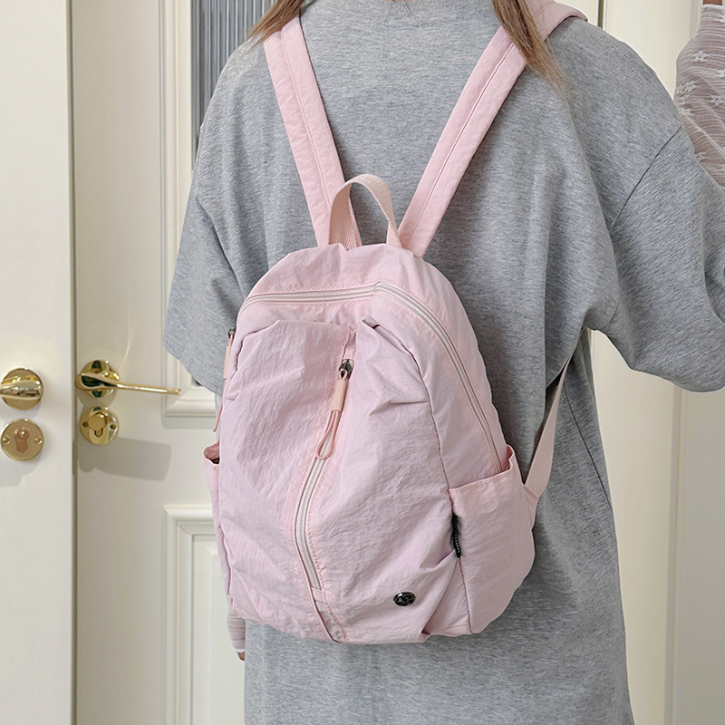 A new high-appearance-level, fresh candy-colored mini backpack from Korean Instagram, a lightweight travel backpack for junior and senior high school girls full figure