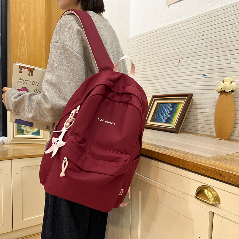 A simple and versatile schoolbag for female college students, a lightweight backpack for commuting, a Korean version of a casual backpack for junior and senior high school students details Picture