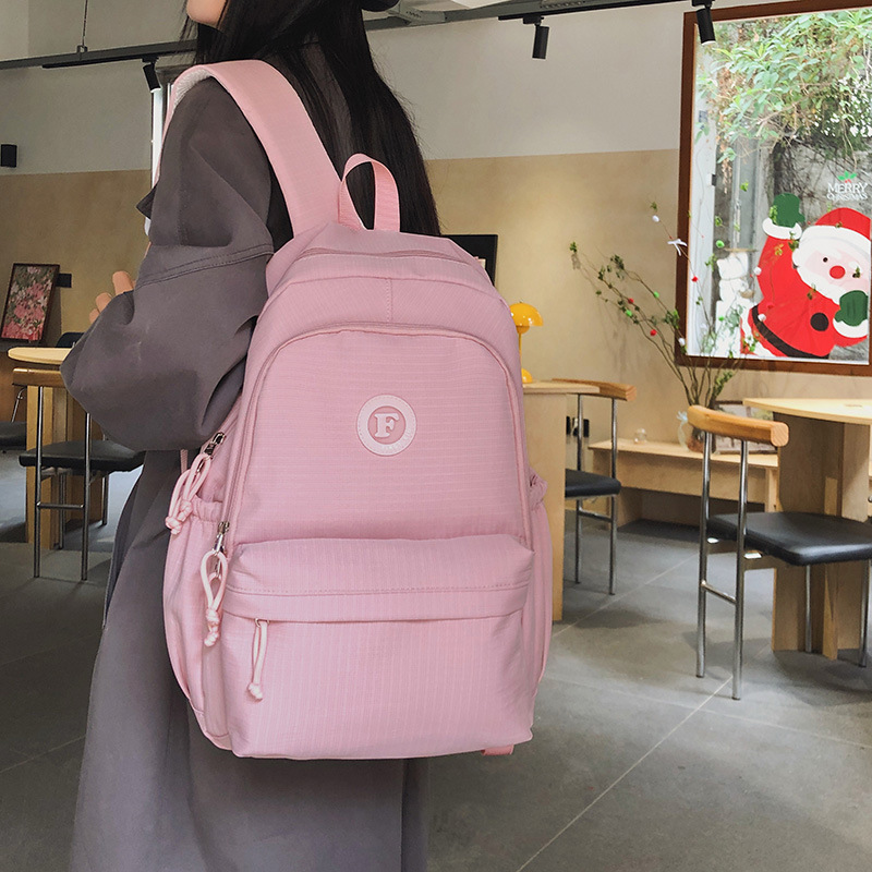 2025 New college-style schoolbag, a large-capacity backpack for junior high school girls, and a simple casual backpack for high school and college students details Picture