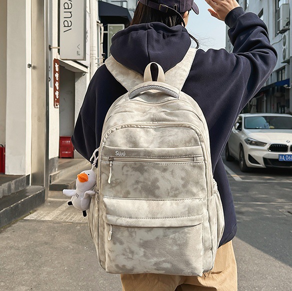 Large-capacity dark-patterned schoolbag, design sense backpack for junior high school students, wide shoulder strap computer backpack for high school and college students, couple full figure