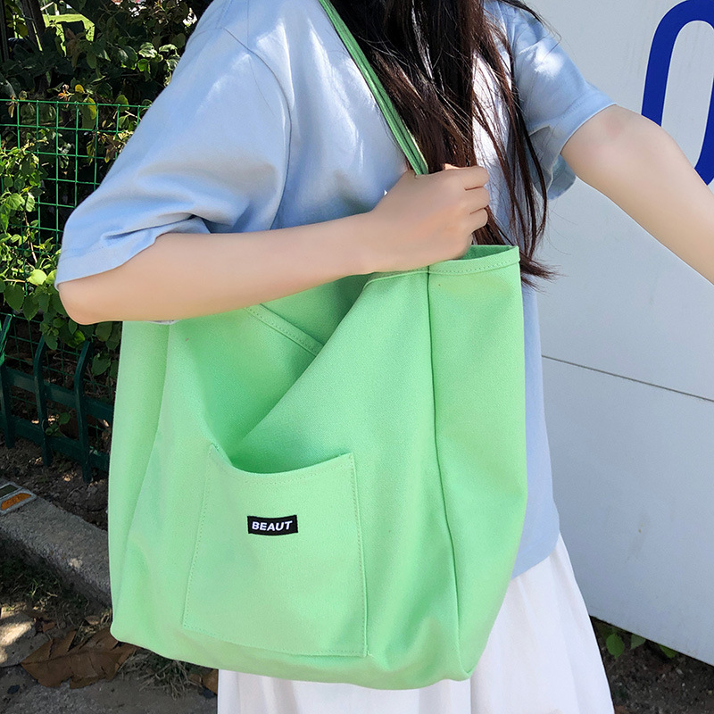 A new 2025 Korean style InS-style single-shoulder bag with a simple and casual large capacity tote bag. This is a versatile backpack in a niche solid color details Picture