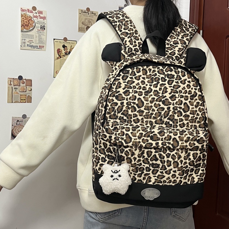 A new large-capacity cat ear leopard print backpack for college students on a niche campus, a casual and simple commuting backpack full figure