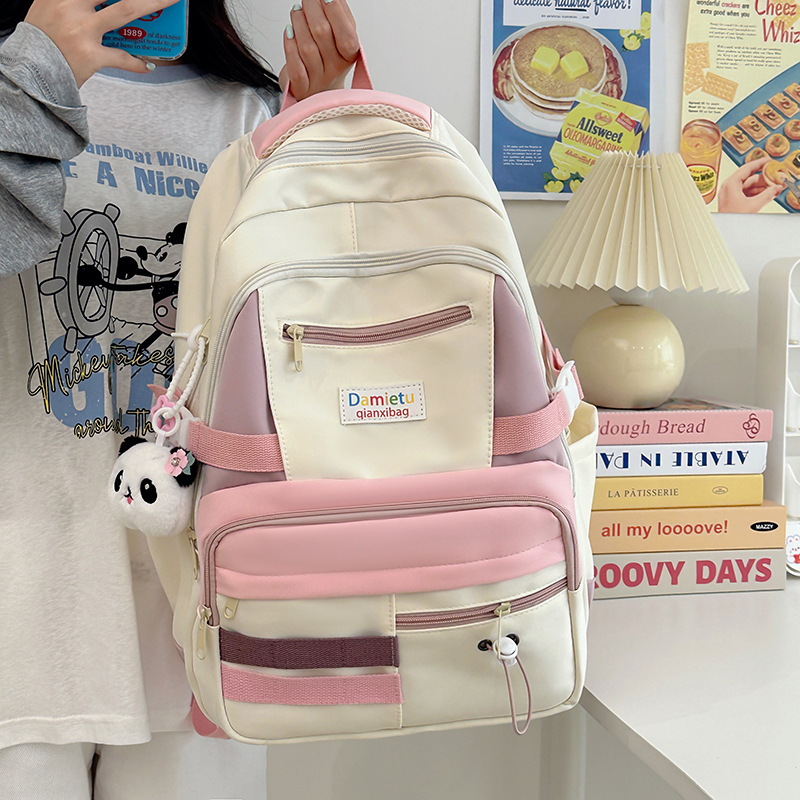 A new 2024 Korean-style, fresh and color-blocking backpack for women, a large-capacity travel backpack, and a school bag for college students details Picture