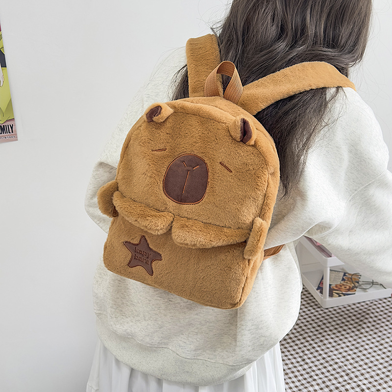 The new Capibara plush Capybara backpack for autumn and winter is cute and versatile. It's a furry bag for girls and cartoon students details Picture