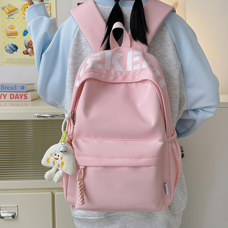 Japanese-style simple and versatile large-capacity solid color school backpack, new Spring 2025 lightweight commuter student backpack full figure