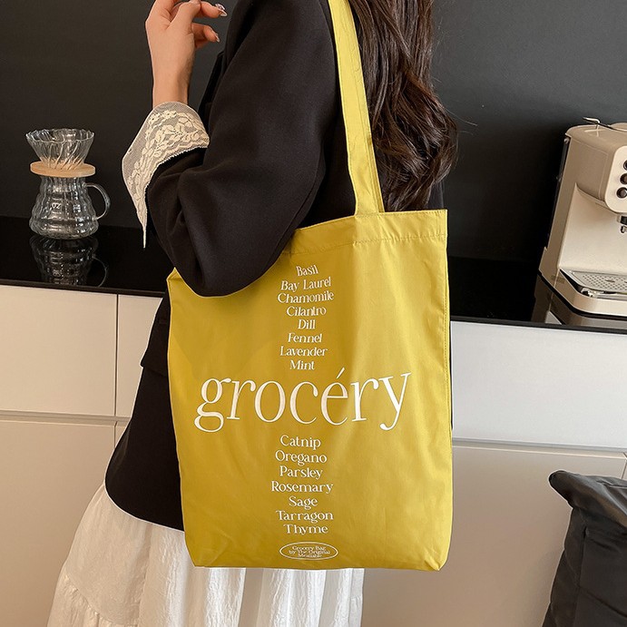 A new high-appeal, fresh and simple letter-printed handbag for women. It's a versatile and large-capacity crossbody bag for work and commuting full figure