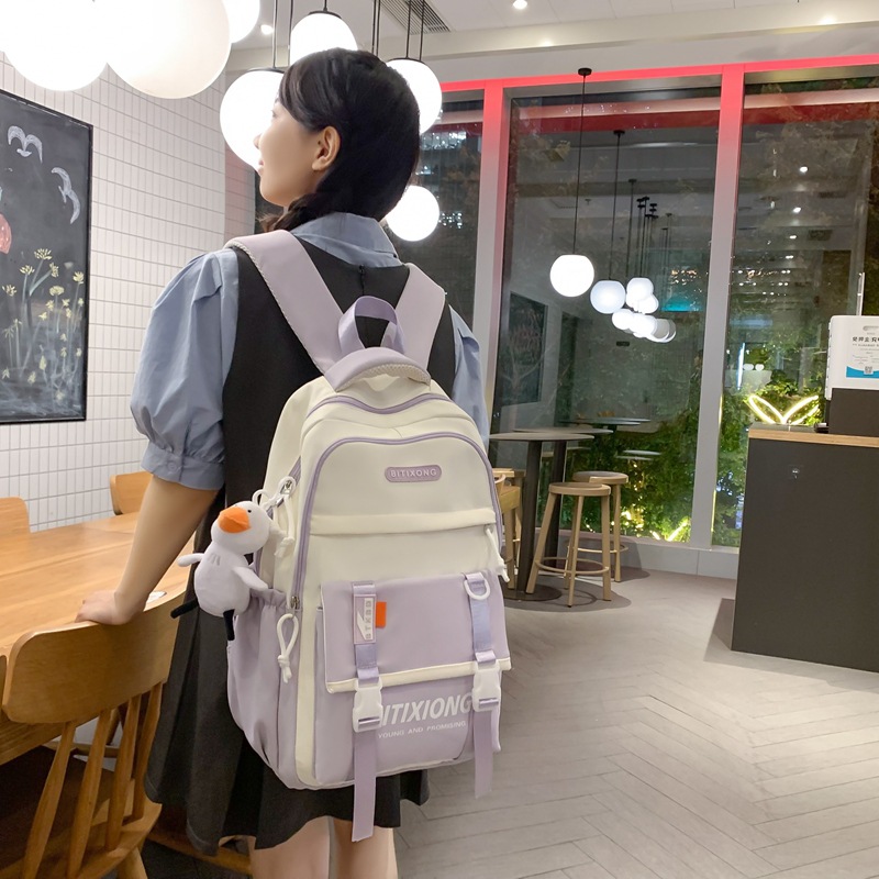 The 2025 new large-capacity, color-blocking, fashionable, multi-layered backpack for junior and senior high school students is versatile, simple and casual full figure