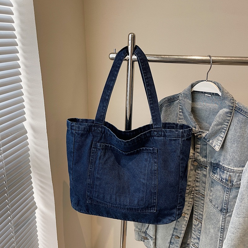 A niche and stylish embroidered denim backpack, a large-capacity versatile tote bag for commuting, and a retro casual student handbag Application Scenario