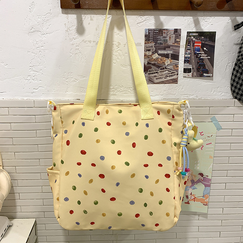 A new high-appeal, fresh and cute printed backpack for students, a casual, simple, lightweight and versatile large-capacity crossbody bag Specification drawing