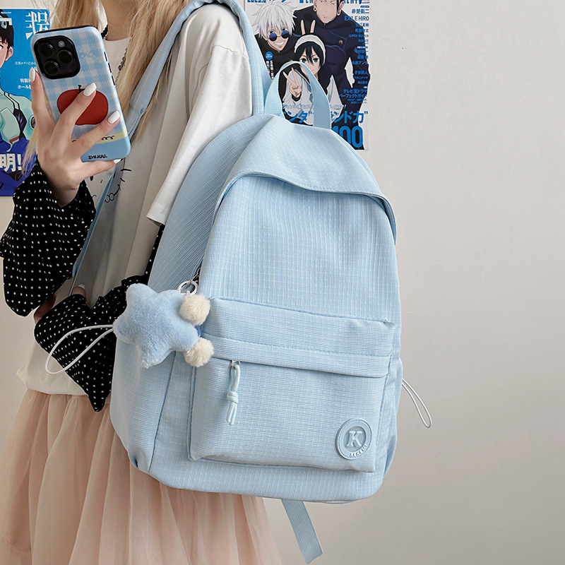 A fresh and versatile schoolbag with a unique Korean ins school style for spring, featuring a high level of appearance. It's a small backpack for girls to go shopping details Picture