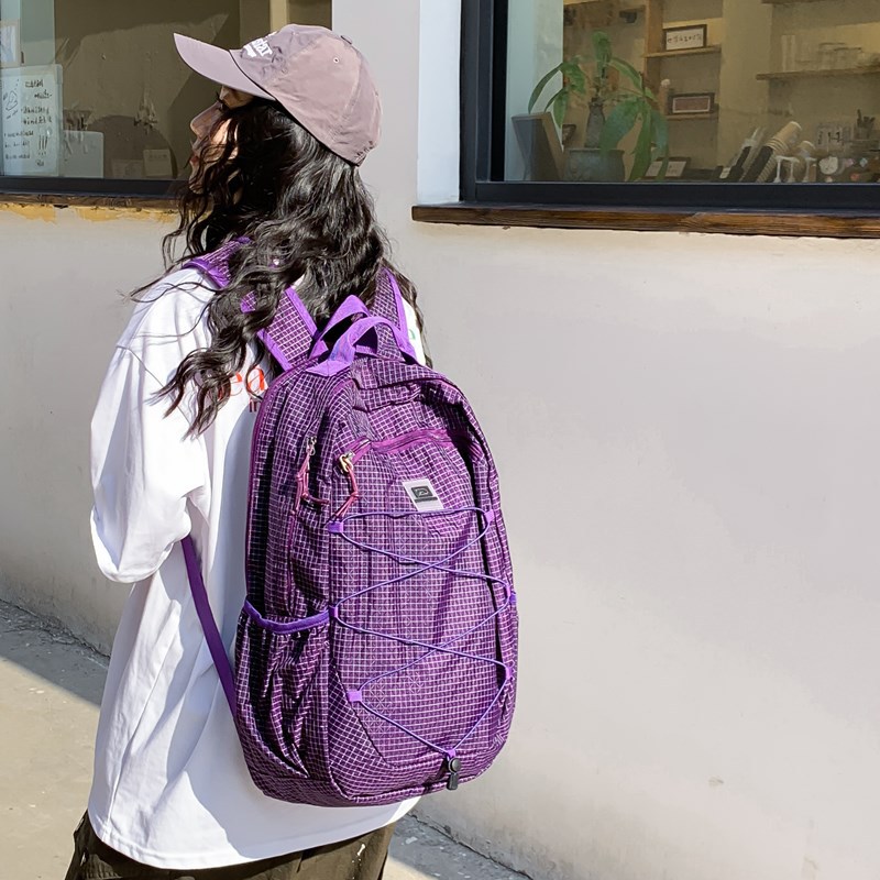A new trendy brand with a high level of appearance, a Korean-style ins solid color drawstring backpack, a simple and lightweight solid color travel backpack for women full figure