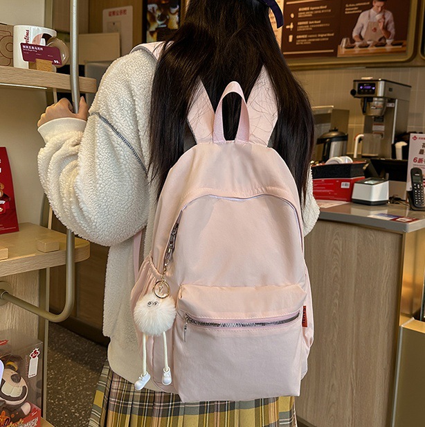 2025 New schoolbag for girls, Korean version, large capacity backpack for junior high school girls and senior high school students, simple and solid color backpack in forest style full figure