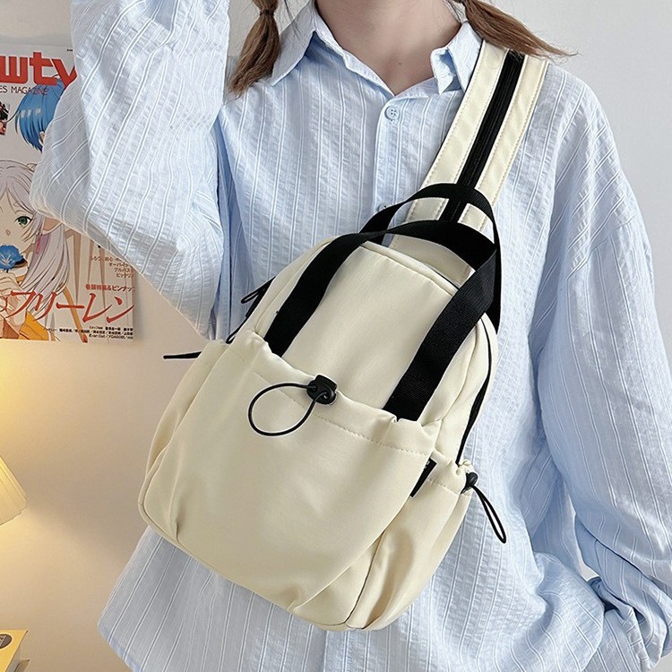 Summer new simple solid color mountain-style functional small shoulder bag, versatile for outdoor travel and sports, lightweight small backpack for men full figure