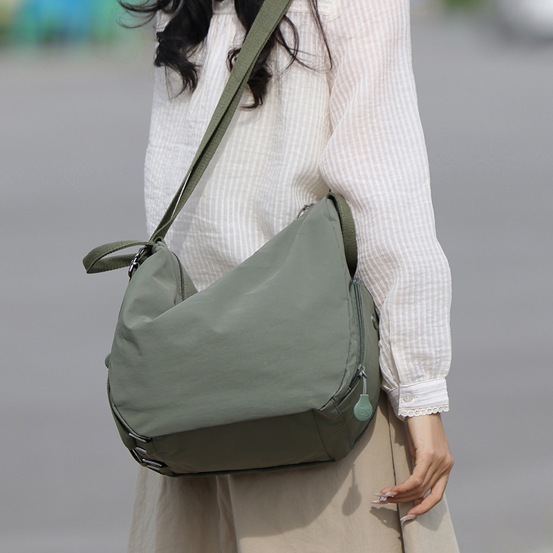 A new women's casual backpack with a forest style, ins solid color, three-in-one, simple and lightweight travel and mountaineering backpack full figure
