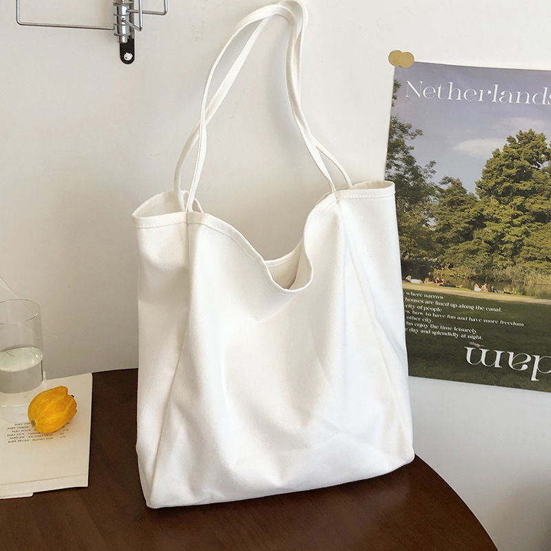 A new 2025 Korean style InS-style single-shoulder bag with a simple and casual large capacity tote bag. This is a versatile backpack in a niche solid color Specification drawing