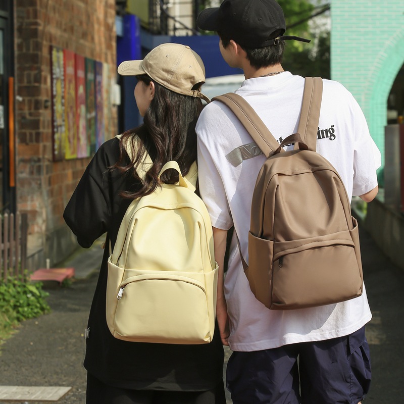 The 2025 new solid-color simple backpack is a versatile, simple, casual and fashionable Korean-style commuting backpack for college students full figure