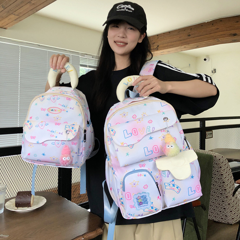 New letter graffiti backpack for cute girls, lightweight backpack for junior and senior high school students, dopamine school bag for primary school students to start school details Picture