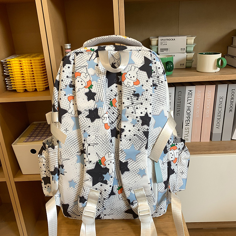 The new high-appearancelevel five-pointed star ins backpack is a casual, simple, fashionable and versatile large-capacity backpack for junior and senior high school students Specification drawing