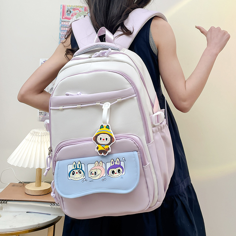 Color-blocking cartoon large-capacity multi-compartment schoolbag, versatile high appearance level backpack, simple and casual travel bag for going out full figure