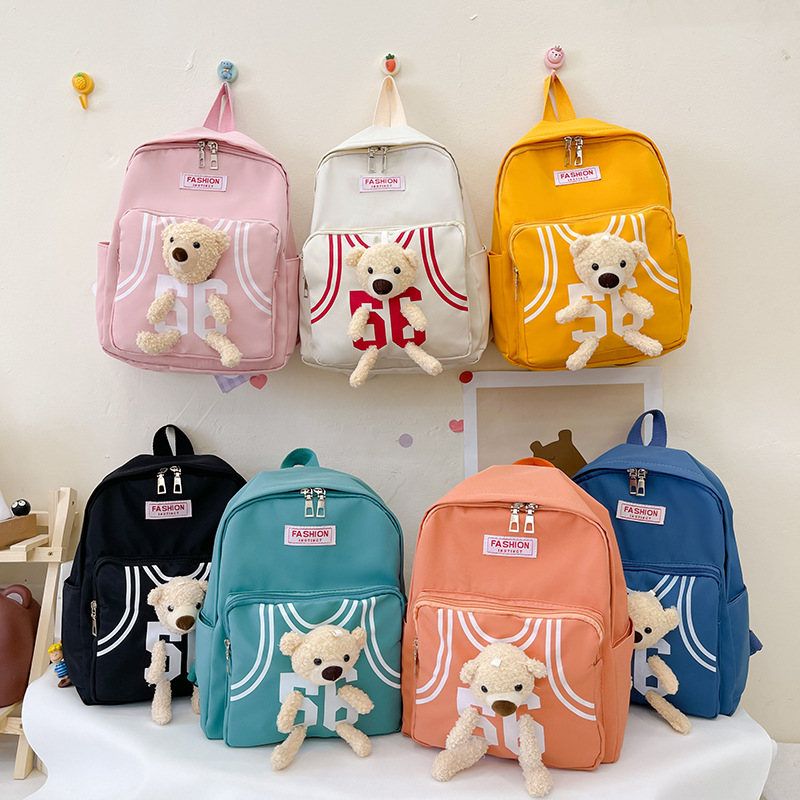 Kindergarten children's cartoon backpacks, girls' and boys' baby team uniforms, bear double-shoulder schoolbags full figure