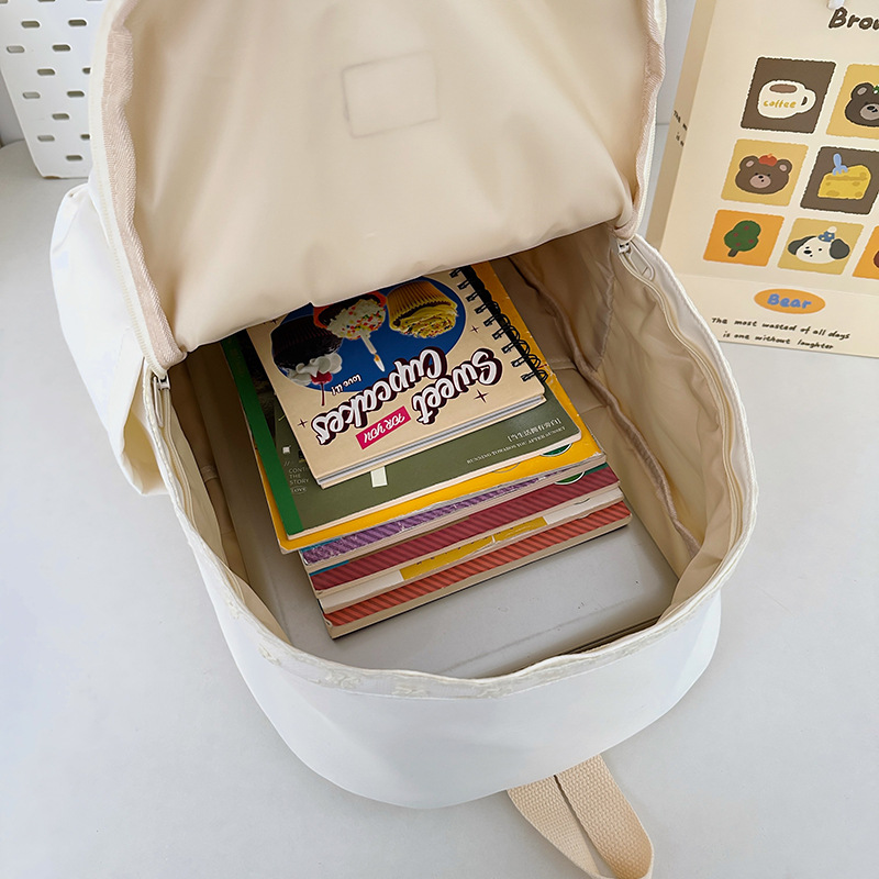 A new Japanese-style backpack with a high level of appearance, fresh and sweet candy color, is a casual and simple large-capacity backpack for primary and secondary school students Application Scenario