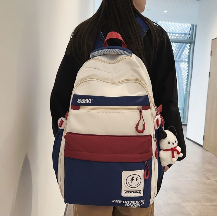 Simple and fashionable backpacks for male college students, large-capacity bags for junior and senior high school students, and trendy color-matched ins backpacks for couples full figure