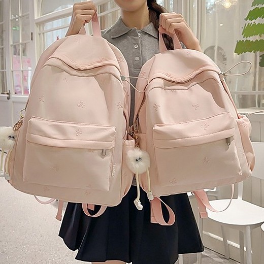 The new Japanese-style ins high-appearance-level fresh and sweet candy-colored bow backpack is a lightweight backpack for junior and senior high school students full figure
