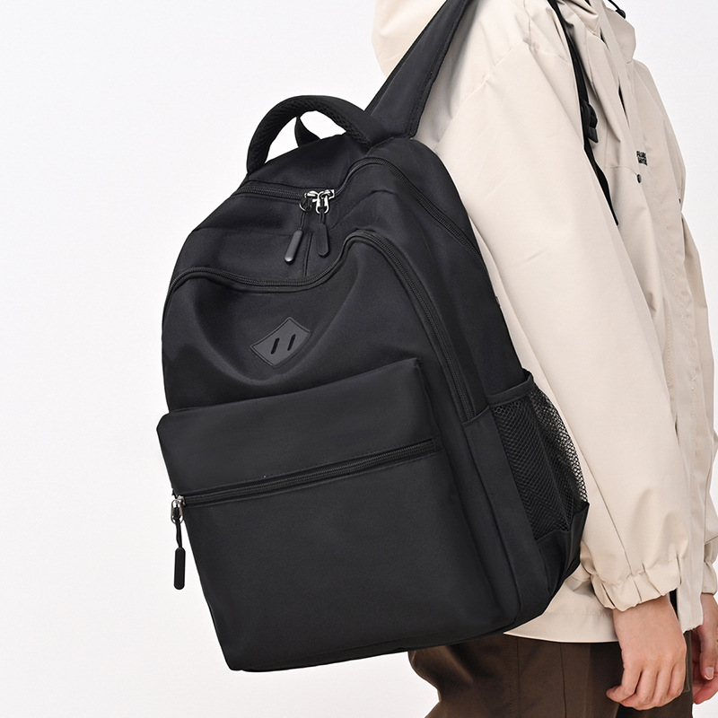 A new high-appeal Korean-style ins backpack for junior and senior high school boys, in a solid color, casual, simple, lightweight and large-capacity backpack details Picture