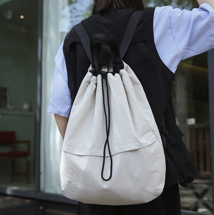 Niche drawstring backpacks for men, casual schoolbags for women, lightweight outdoor cycling backpacks, drawstring bags, hiking travel bags for men full figure