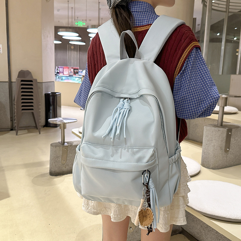 2024 New schoolbag for girls, Korean version, large capacity backpack for junior high school girls and senior high school students, simple and solid color backpack in forest style details Picture