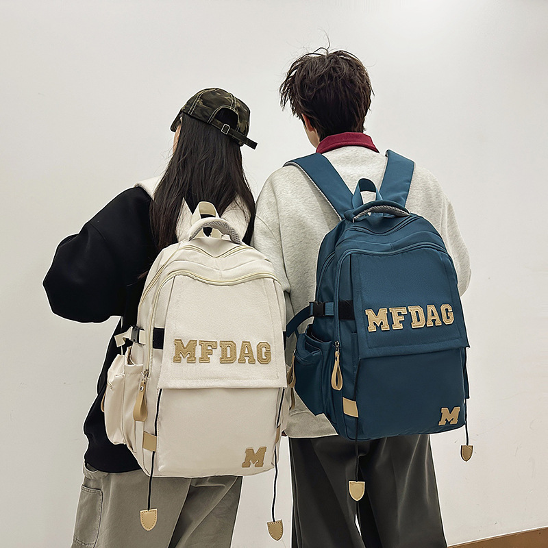 2025 New large-capacity, versatile solid color letter multi-compartment junior and senior high school schoolbag, high appearance level, lightweight backpack full figure