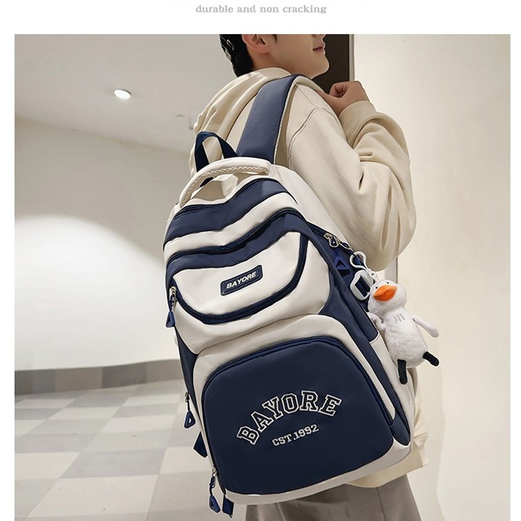 A simple and versatile travel backpack for female college students in Korean style, a large-capacity backpack for high school students with a masculine feel details Picture