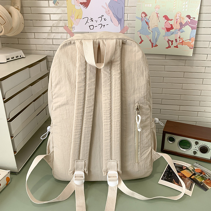 Solid-color high-end backpack for women, simple and elegant college student schoolbag, lightweight high school student, large-capacity couple travel backpack Specification drawing