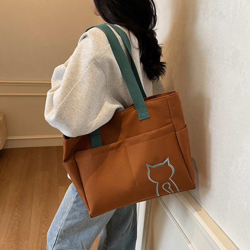 New summer Korean-style lightweight color-blocking hand-held canvas bag, casual and versatile shoulder bag, simple commuting tote bag full figure