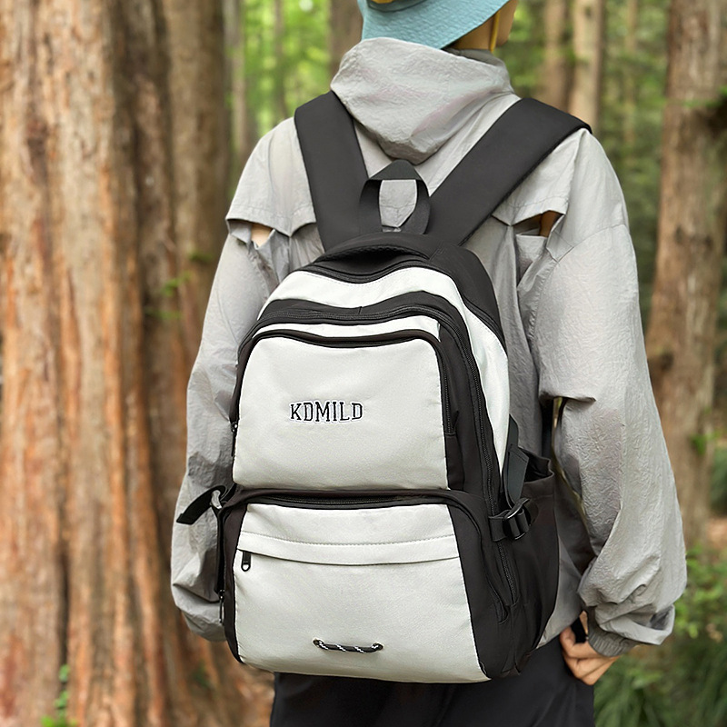 Outdoor hiking bags, lightweight travel backpacks for girls, schoolbags for junior and senior high school students, large-capacity couple computer backpacks for boys full figure