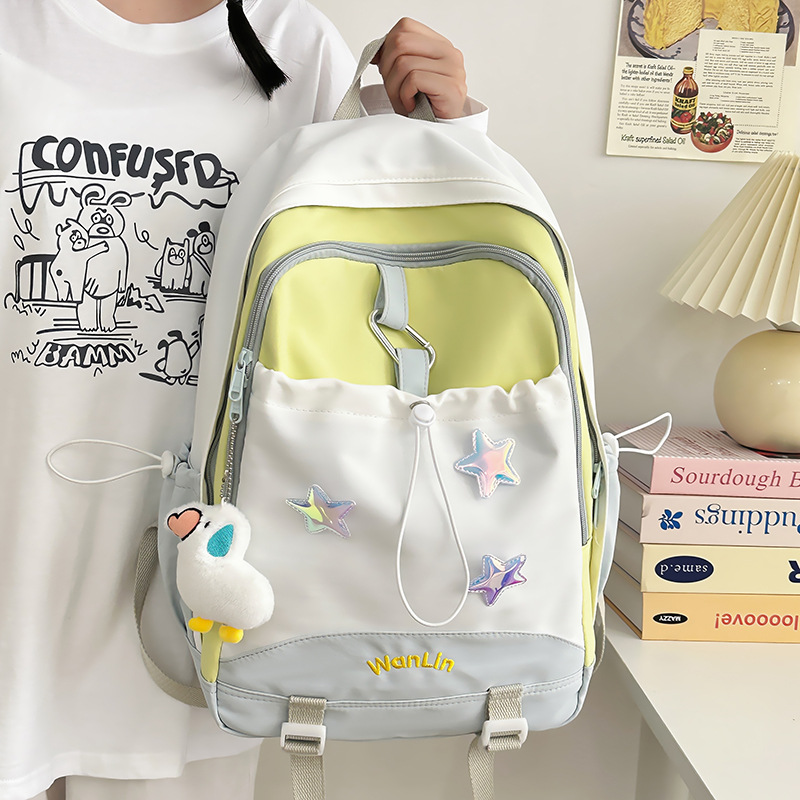 Korean macarons are cute and versatile. Junior high school schoolbag, girl's stylish color-blocking backpack, high appearance level high school student backpack full figure