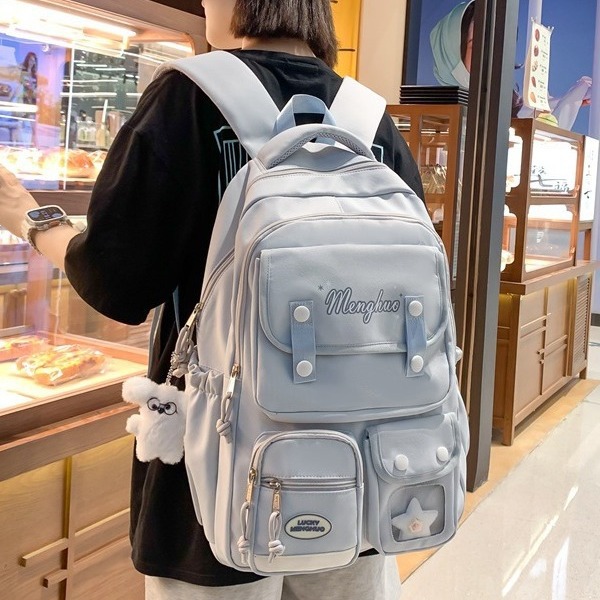 A soft and fresh schoolbag with a Korean school style, a multi-layered design, and a solid color backpack for female junior high school students details Picture