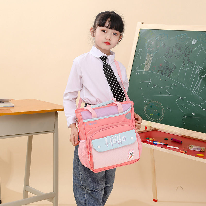 2025 New water-resistant children's schoolbag, lightweight student tutorial bag, simple handbag, art bag, printed logo details Picture