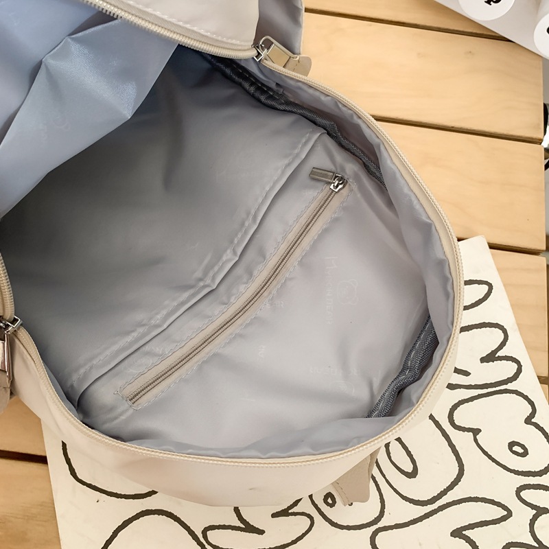 A niche and high-end large-capacity backpack, a lightweight travel and casual backpack, versatile and fashionable forest-themed hand-held schoolbag Application Scenario