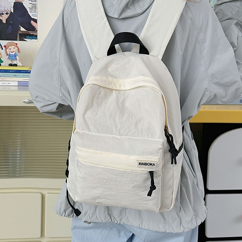 A new Korean-style Instagram backpack with a high level of appearance, fresh and sweet. It is a simple and large-capacity backpack in solid colors for junior and senior high school students details Picture