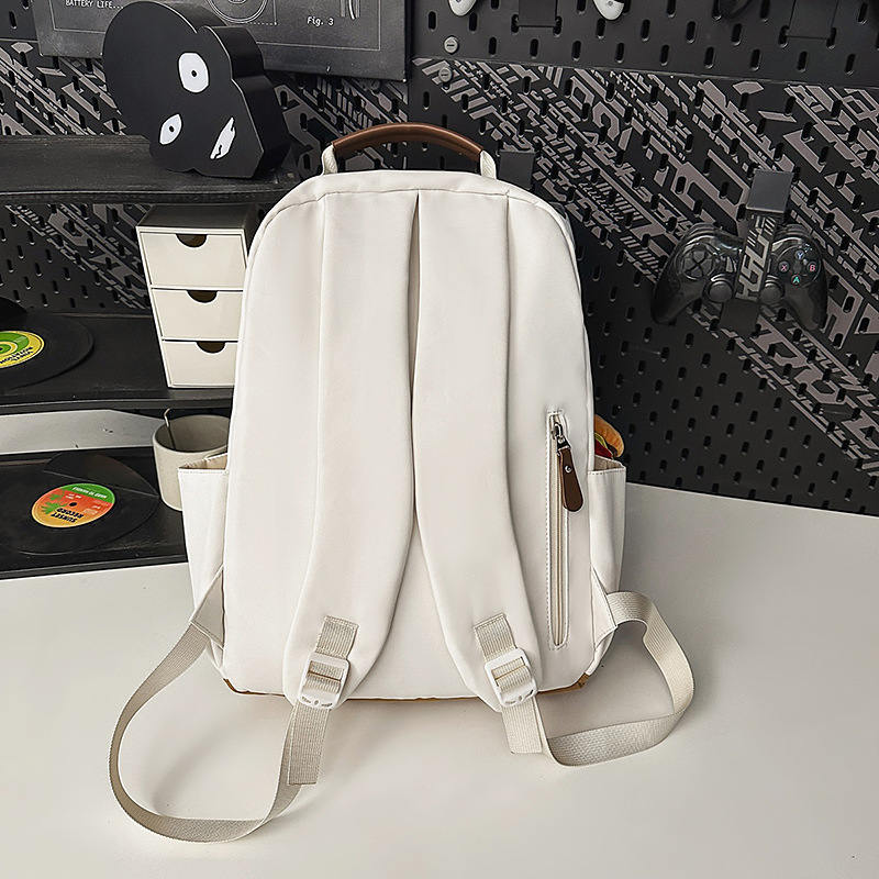 Casual and versatile backpack, Japanese retro fashion for girls, commuting computer travel backpack, solid color schoolbag for college students Application Scenario