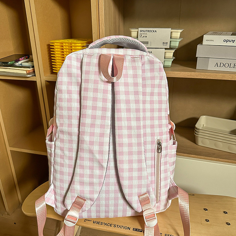 A new high-appeal, fresh and sweet checkered tutorial bag for junior and senior high school students, a simple, lightweight and large-capacity three-piece backpack Specification drawing