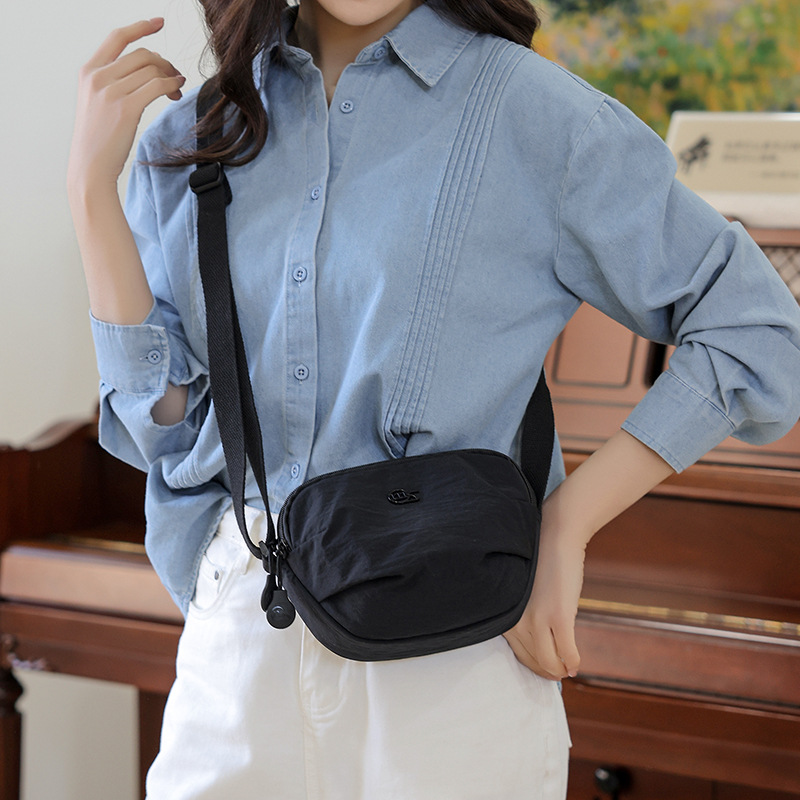 The 2025 new style of fashionable and versatile commuter single-shoulder bag, simple multi-compartment backpack, high appearance level, casual solid color crossbody bag details Picture