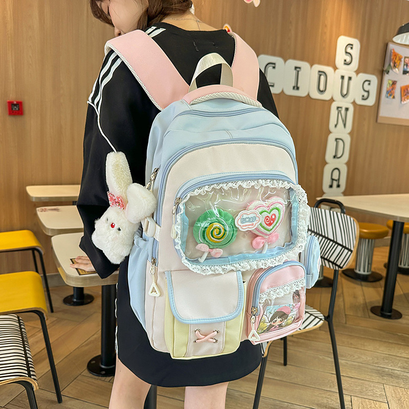 High appearance level dopamine sweet color-blocking girl heart backpack, college style, multi-layered backpacks for junior and senior high school students full figure