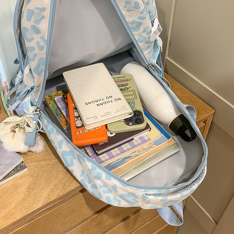 A new Japanese ins Harajuku style cow leopard print backpack, a lightweight and large-capacity backpack for junior and senior high school students to take remedial classes Application Scenario