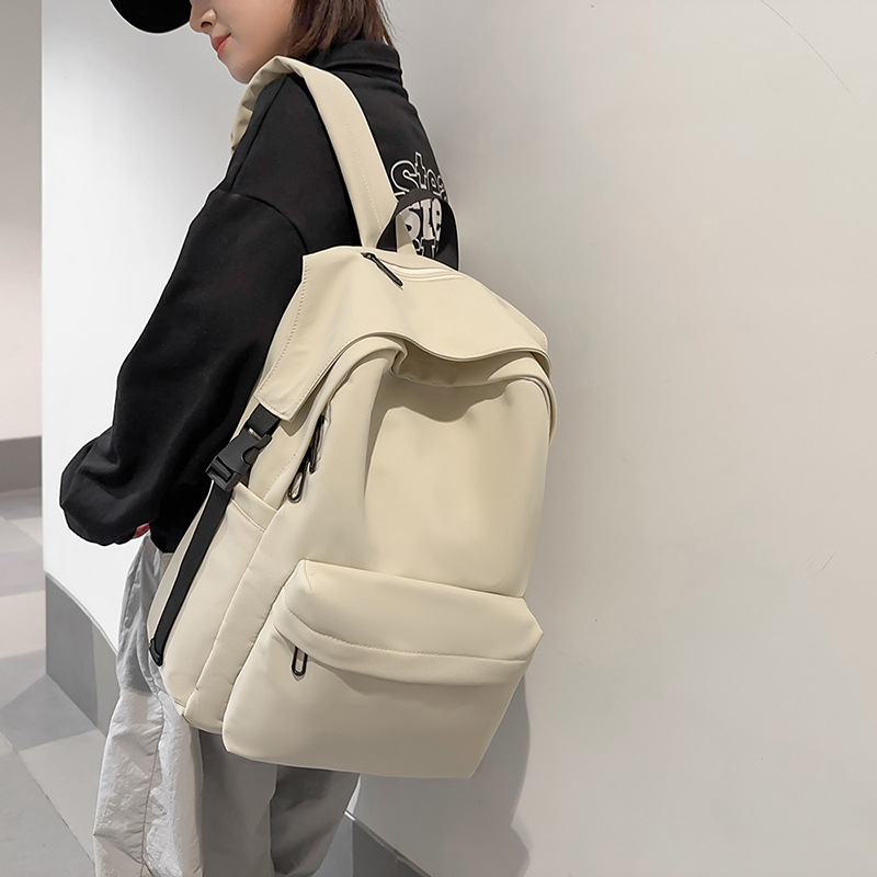 The 2025 new large-capacity simple backpack has a high appearance level. It is suitable for both boys and girls and is a solid color schoolbag for junior and senior high school students details Picture