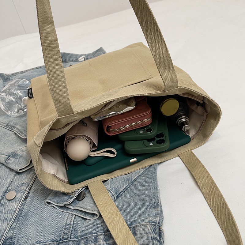 A simple and large-capacity canvas bag for women, a new model of 2025 for college students. It is a versatile single-shoulder tote bag for class and commuting to work Specification drawing