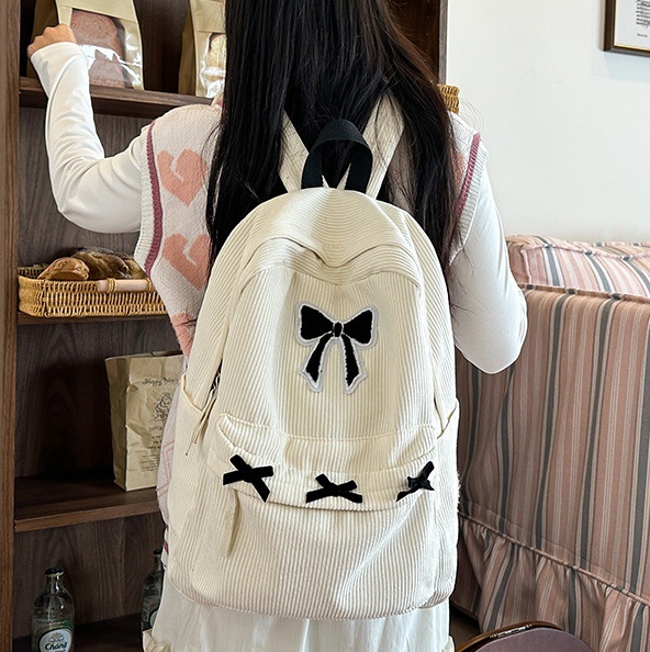 2024 New schoolbag for junior high school girls, high appearance level bow backpack, Korean-style lazy style college student backpack for girls full figure