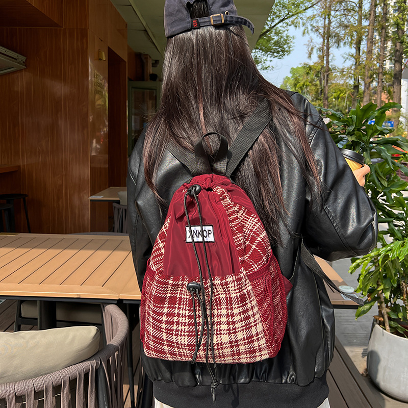 The design sense checkered schoolbag is a simple and versatile backpack for girls in junior and senior high school. It is also a high-appearance-level travel backpack for college students details Picture